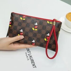 Brand New Disney Wallet With Mickey Mouse covering the Zip-Up Wristlet